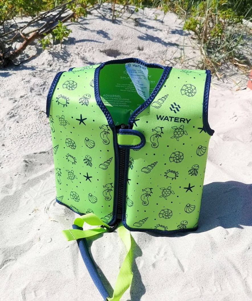 Watery Splashy swim vest on a beach